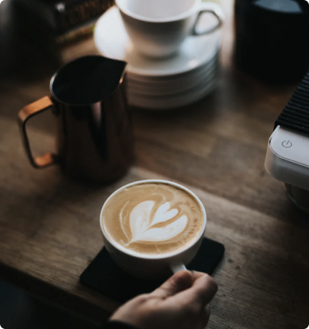 a photo of coffee around cups and beatiful view